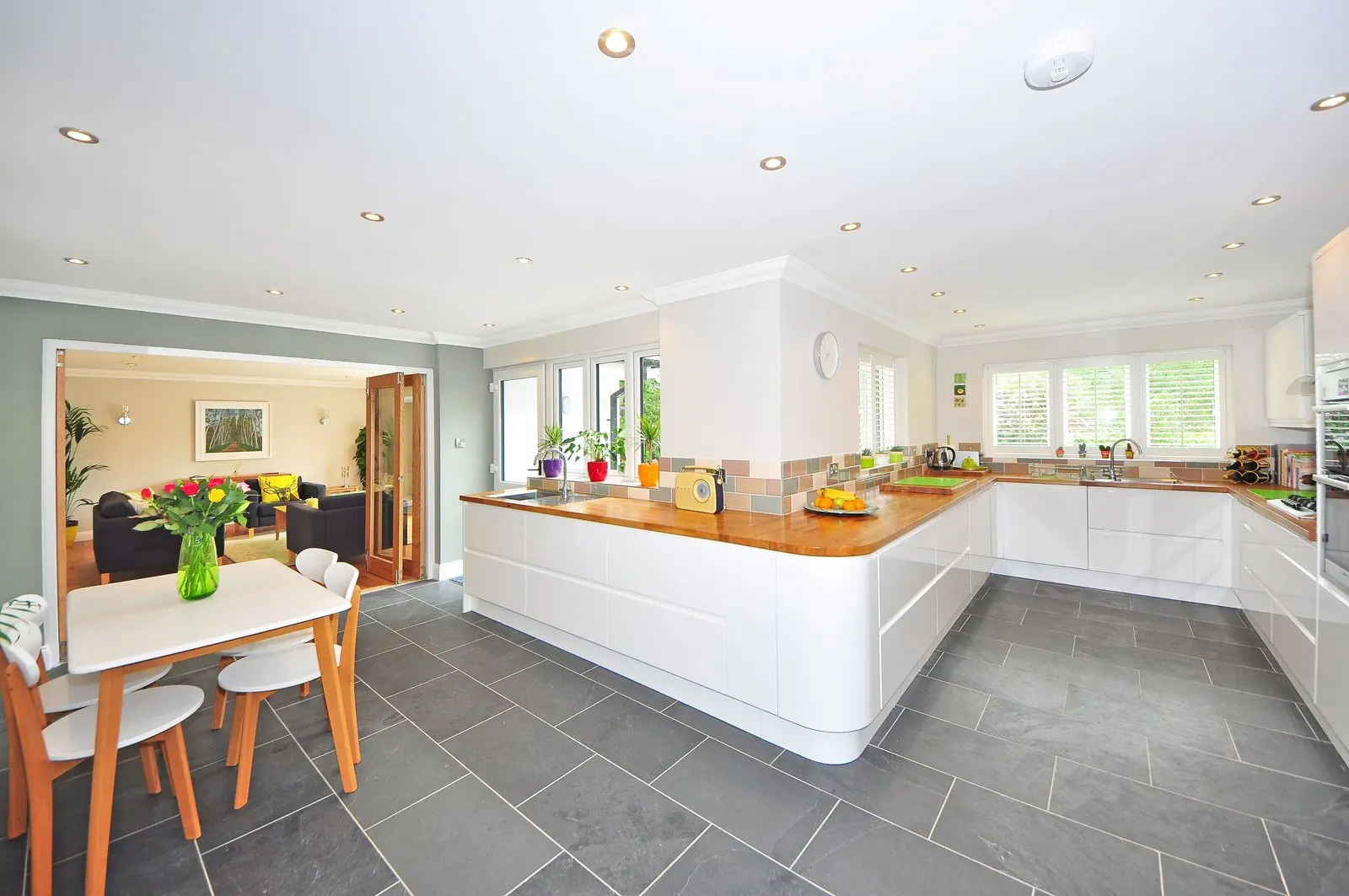 Kitchen with grey slate-look rectangular floor tiles in a half bond