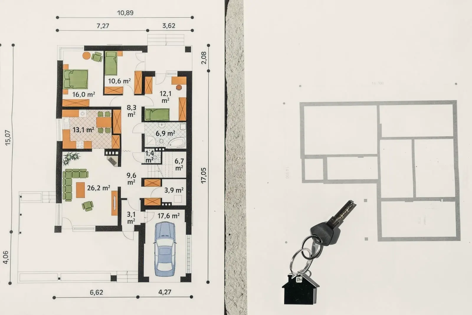 Printed floor plan with room areas and dimensions next to a sketch plan and a house key